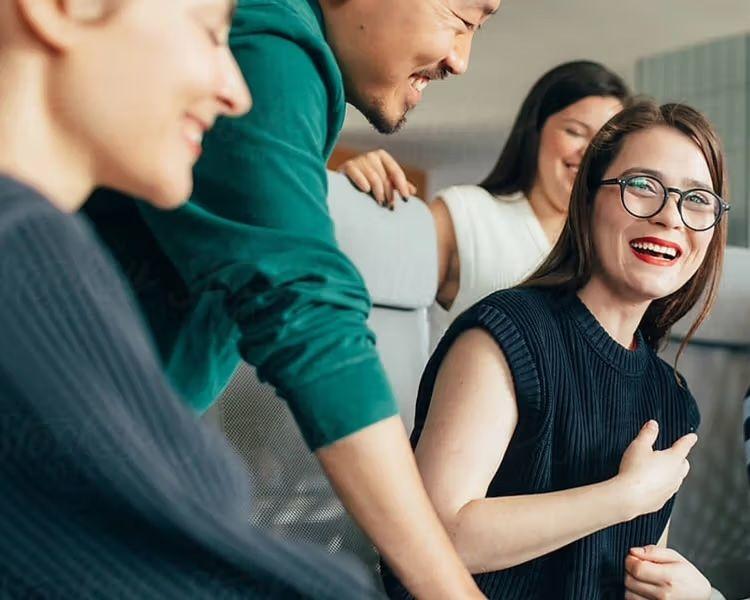 woman with glasses smiling
