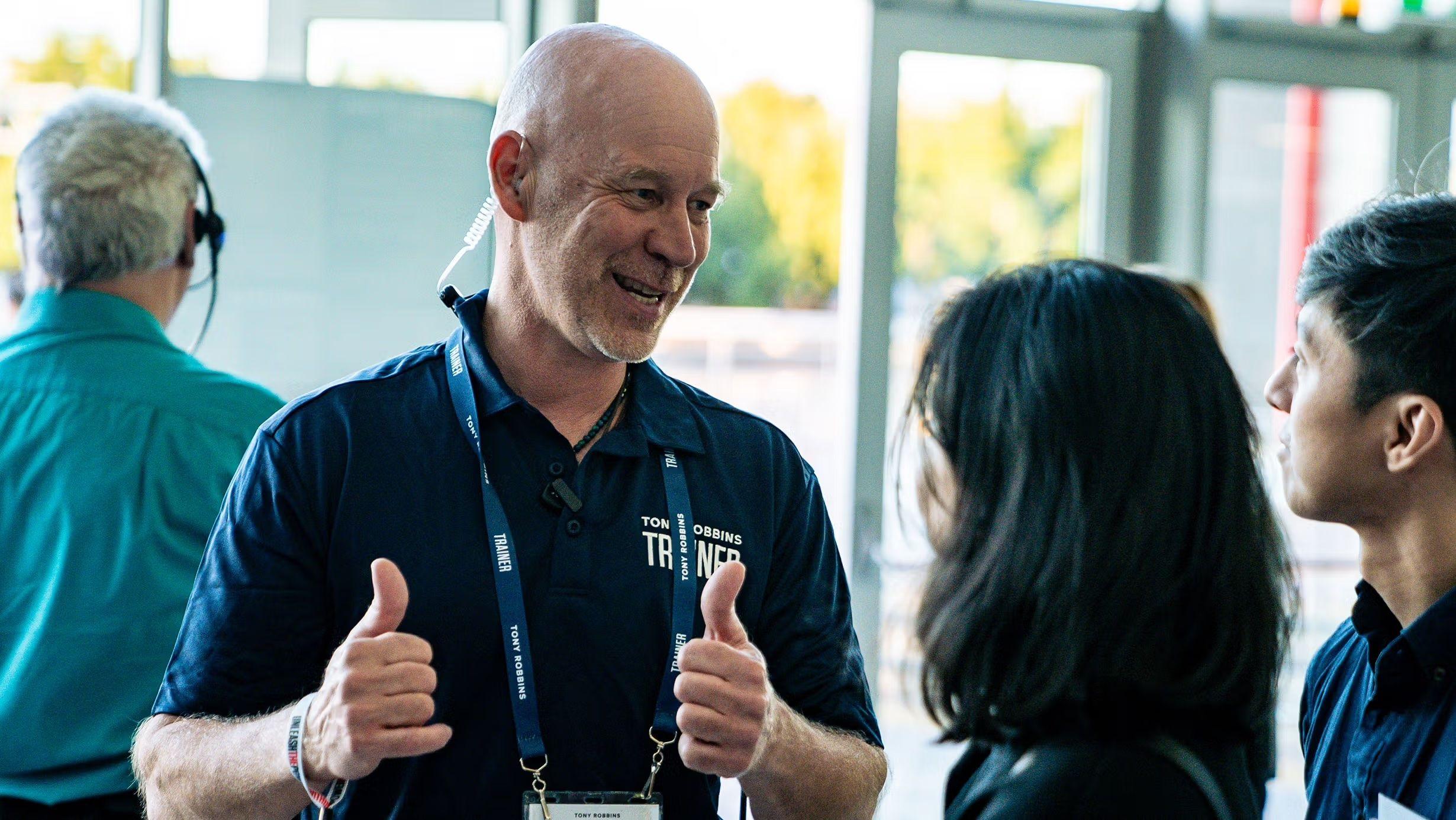 Man giving a double thumbs up